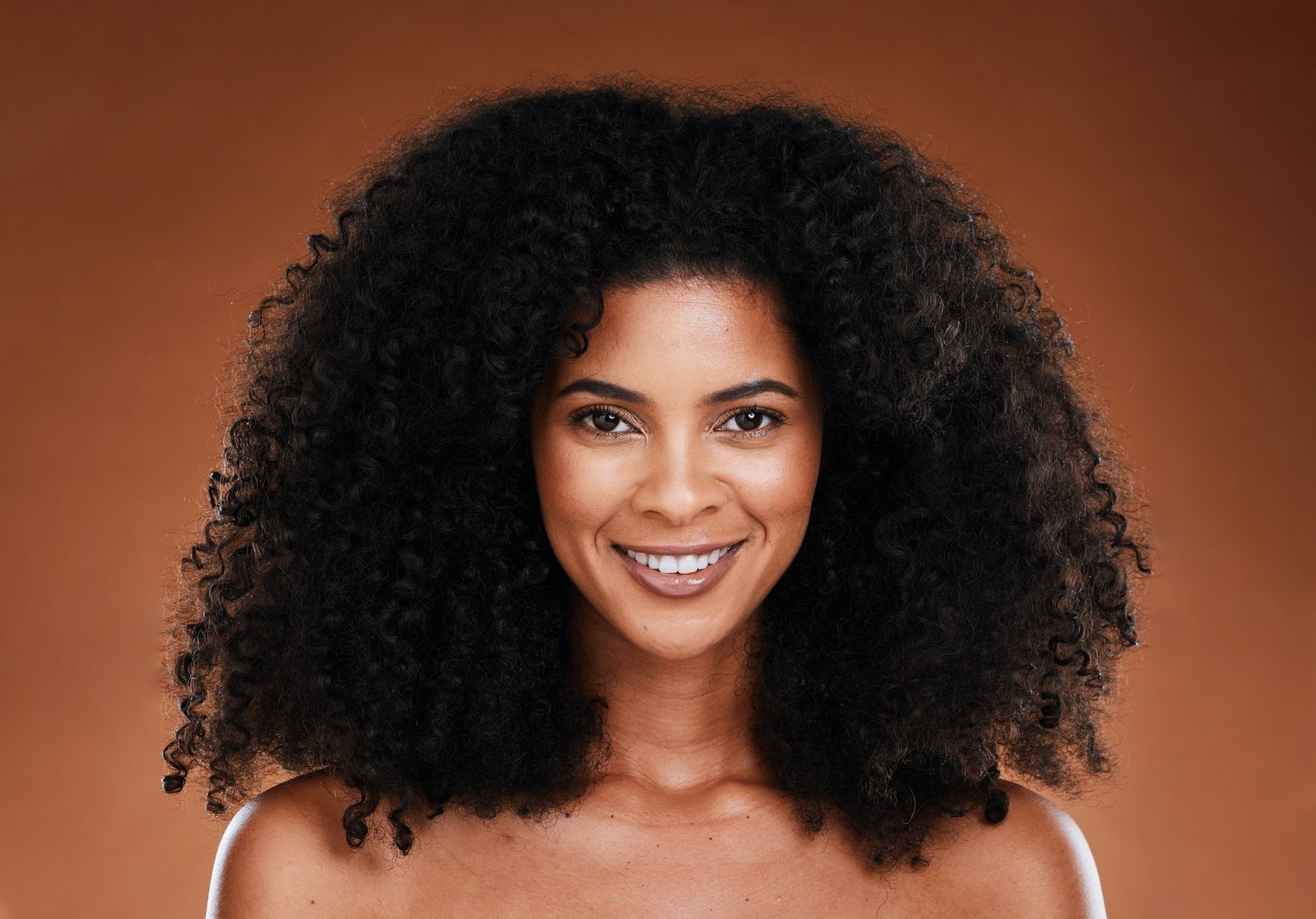 Hair care, natural and beauty black woman studio portrait for healthy hair growth in cosmetics, mak